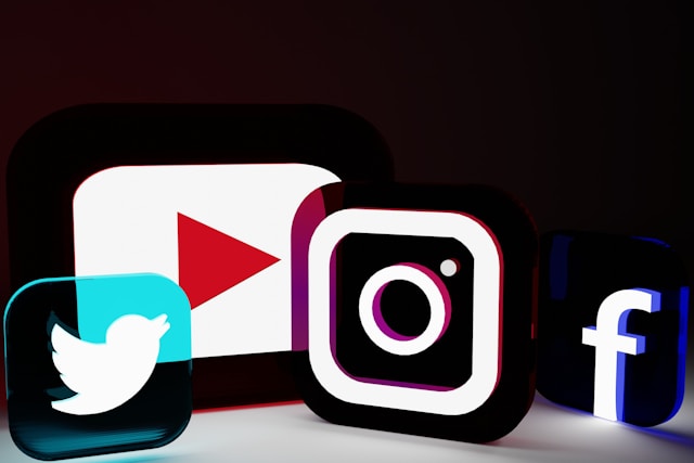 Social media logos with a dark background.